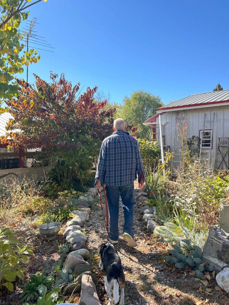 Owner Jefferey Cauffman walking the path to the nursery behind store 